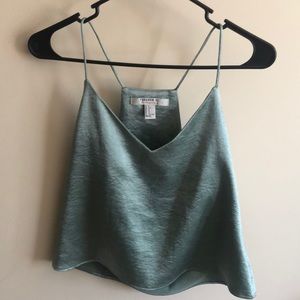 Reflecting teal blouse
